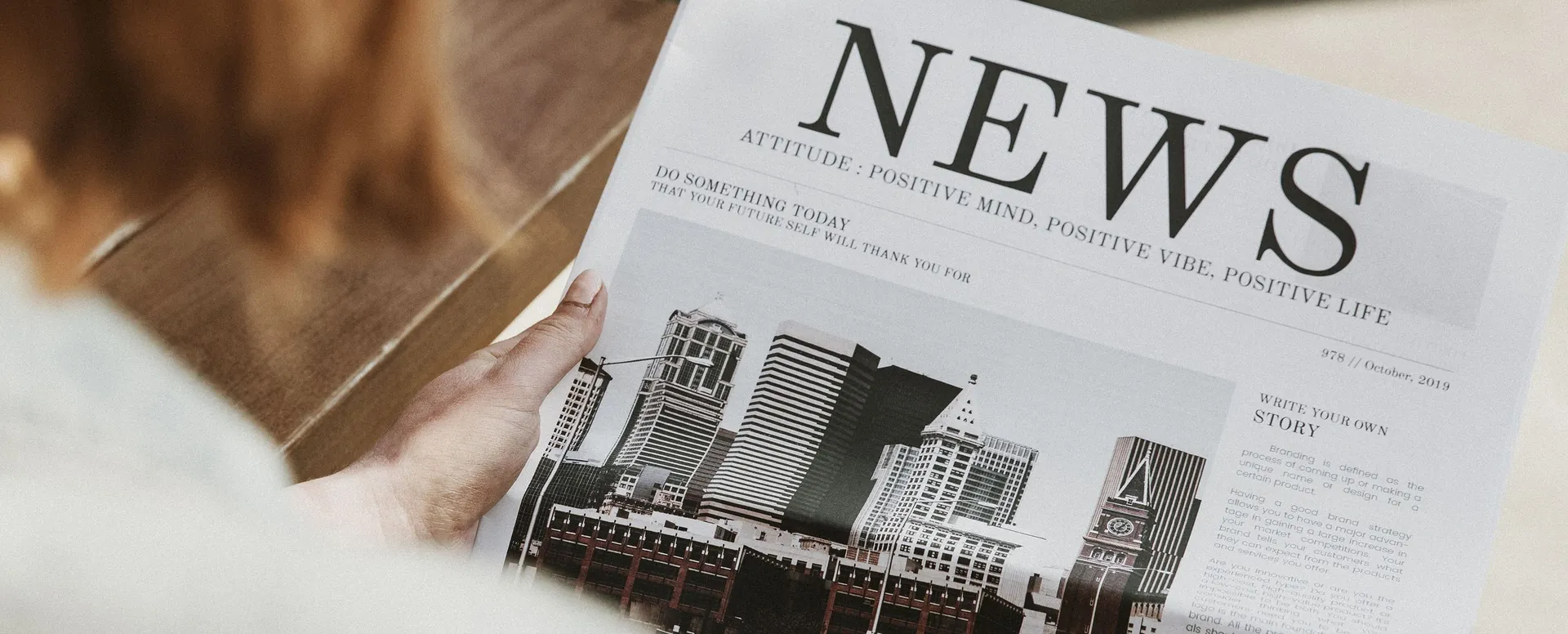 A person reading the morning newspaper